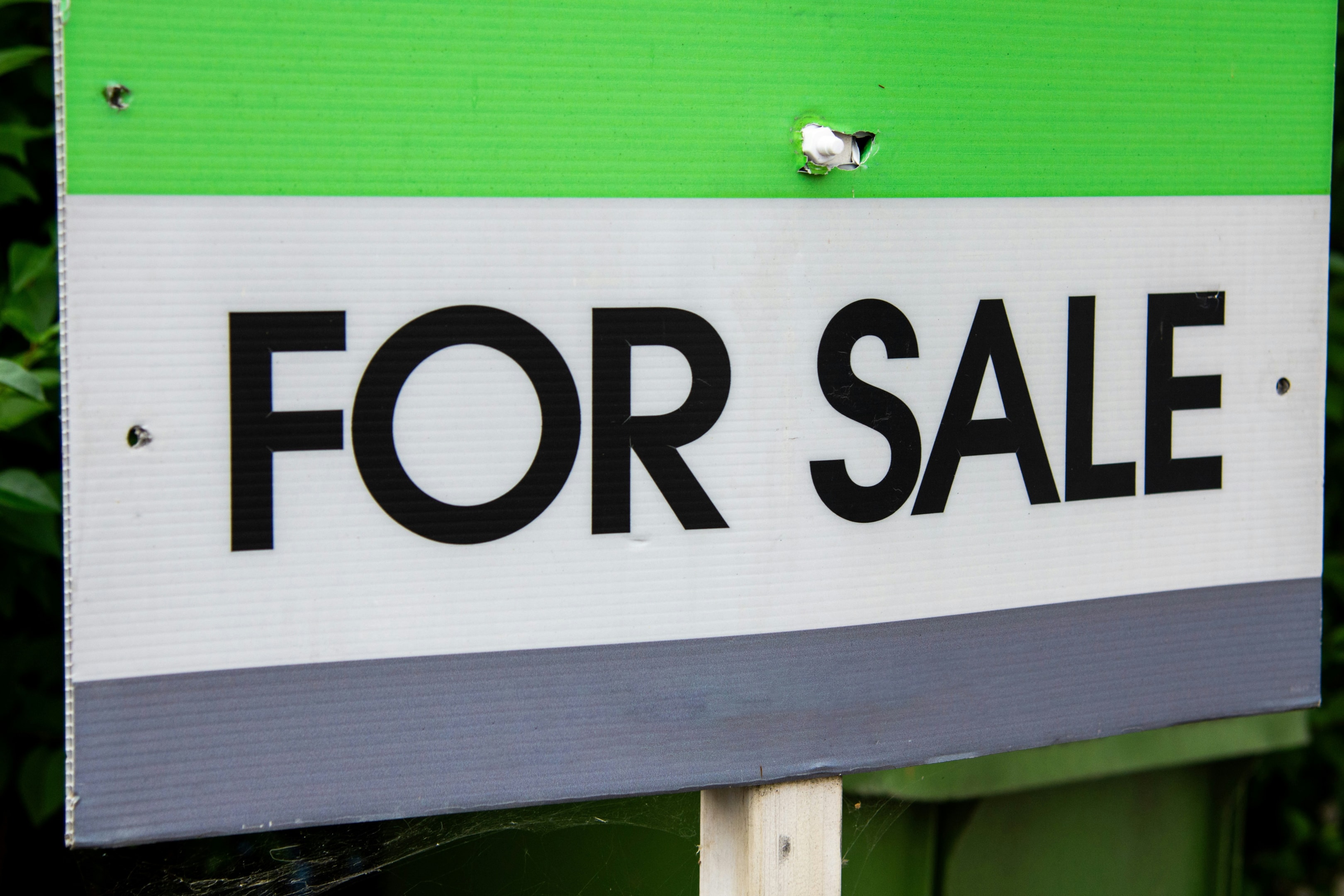 'For Sale' sign in front of probate property.