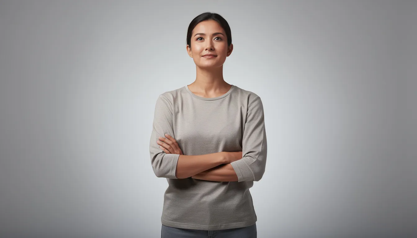 A person stands confidently with arms crossed, exuding calmness and a strong sense of self. This image reflects the importance of setting healthy boundaries and prioritizing one's own well-being in relationships and life.
