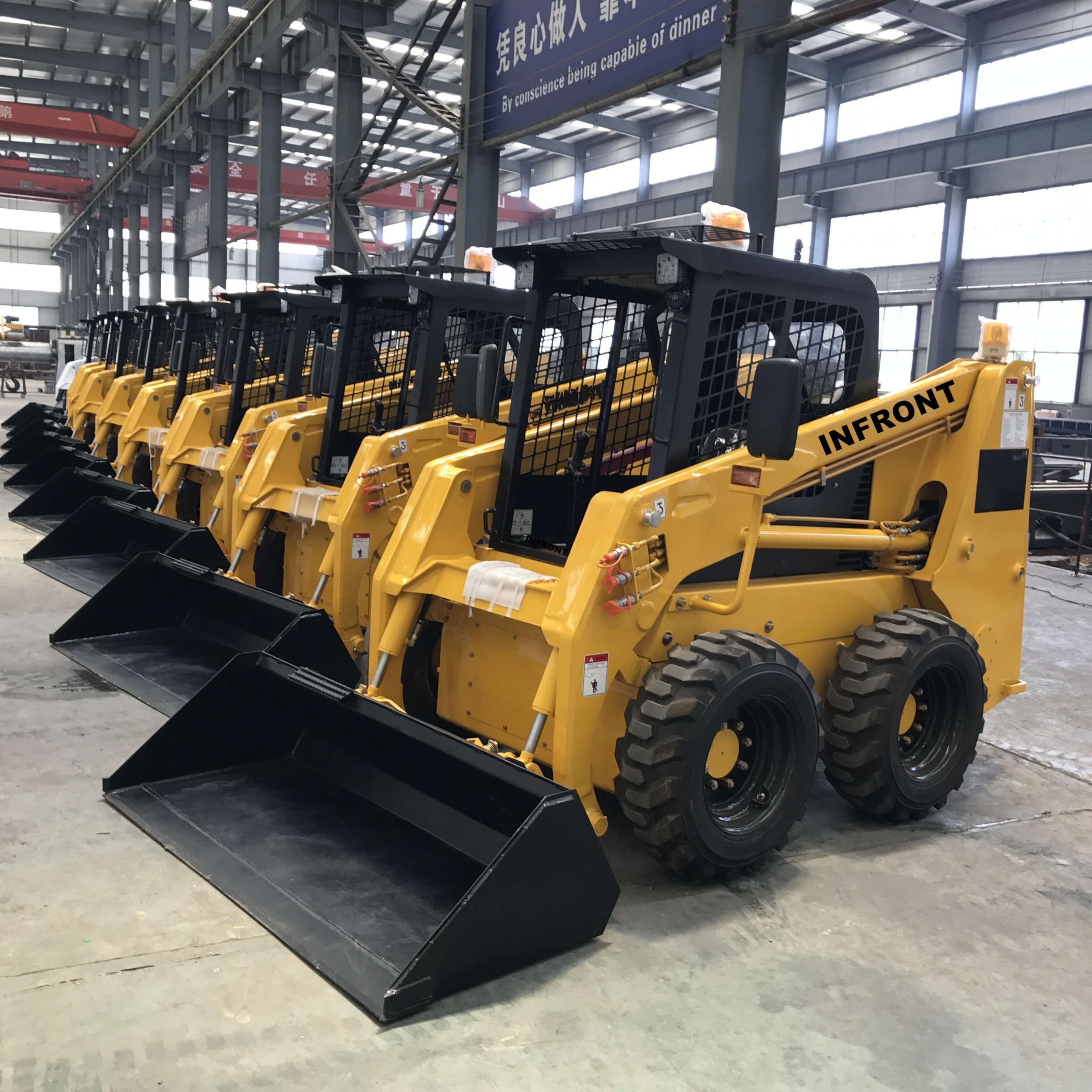 Photograph of Chinese mini skid steer loaders ready to work efficiently.