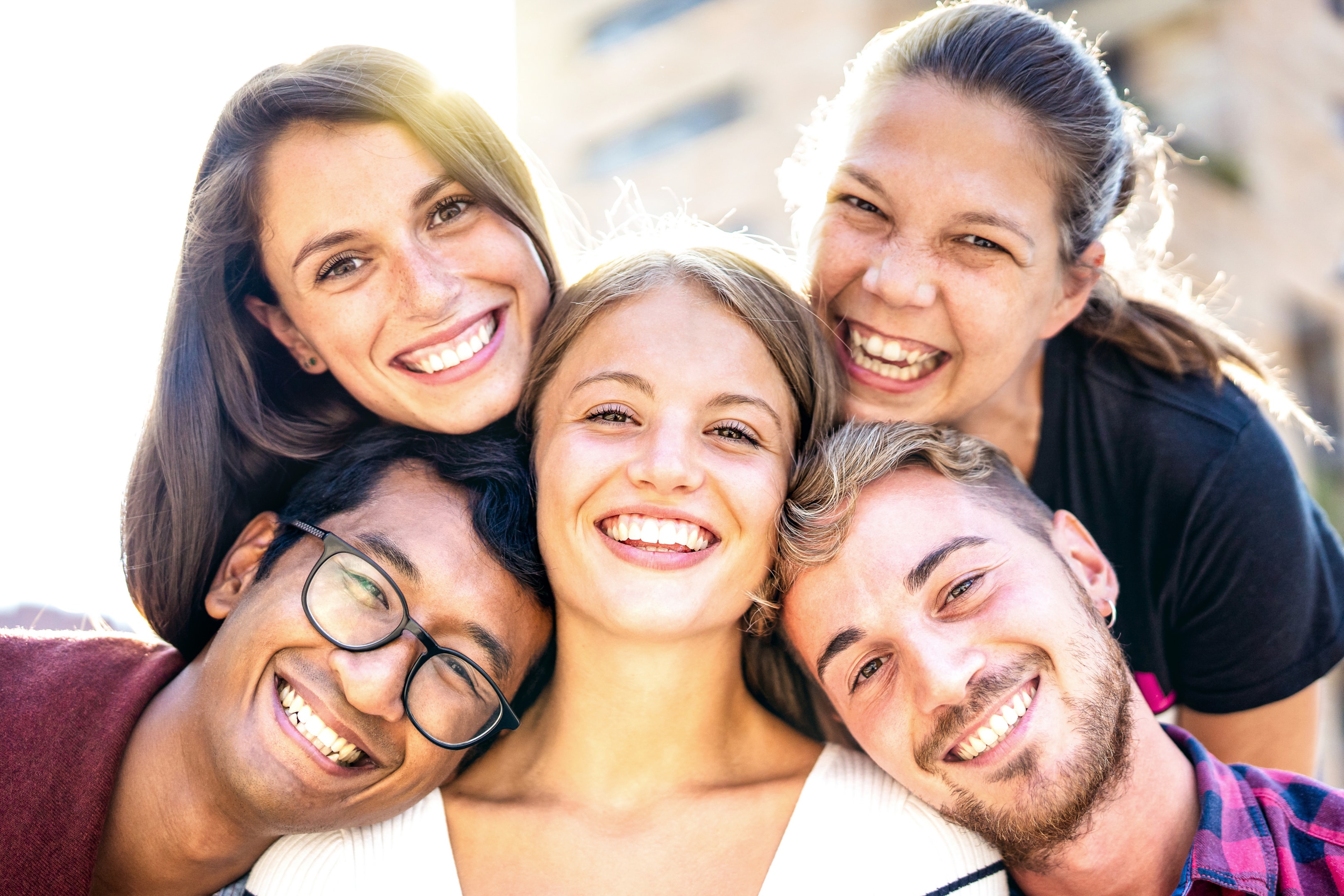 Group smiling with dental implants