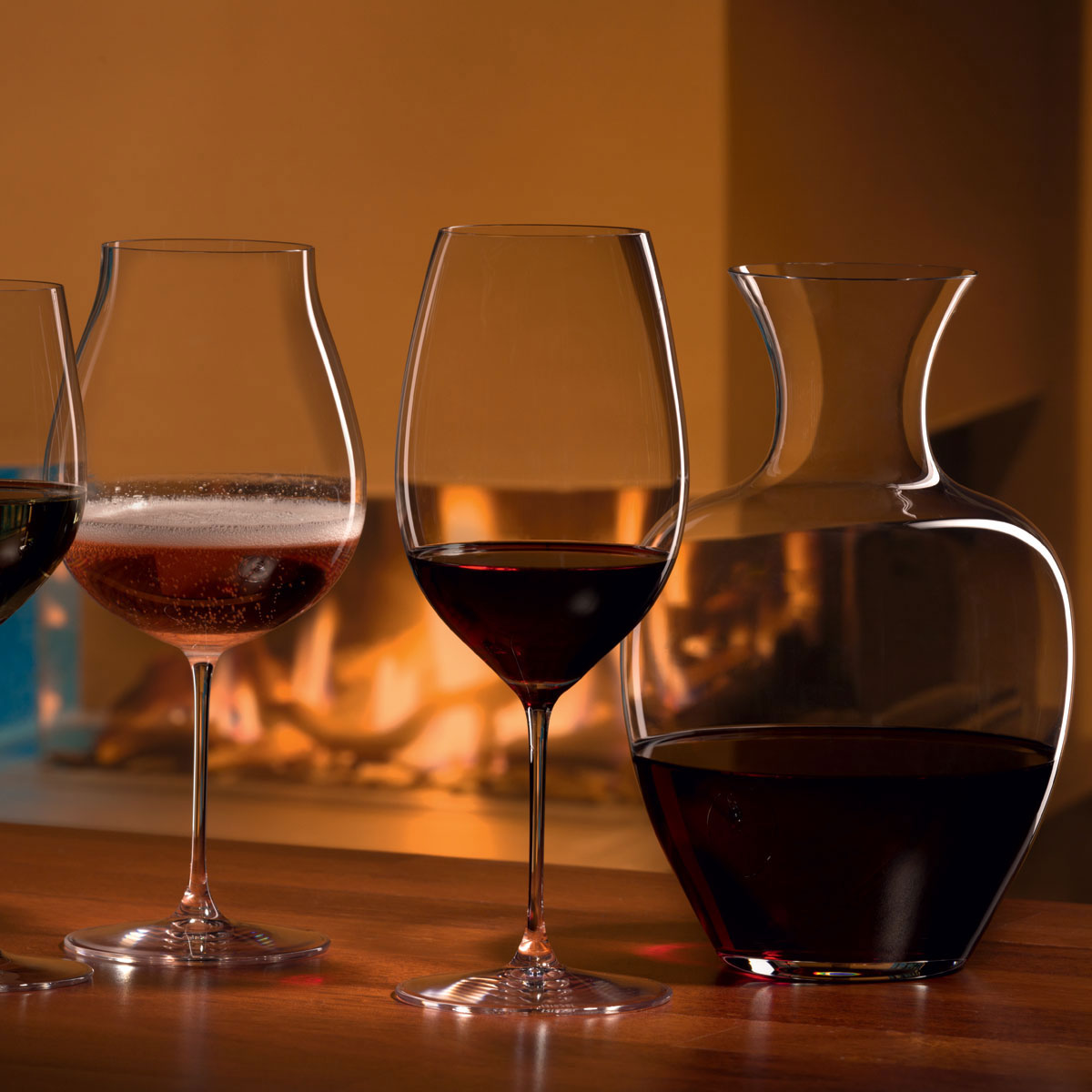 Wine glasses next to a carafe