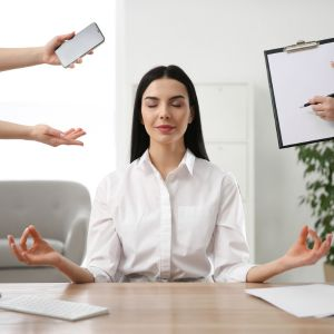 Dealing with day to day stress after chiropractic adjustment woman peacefully working