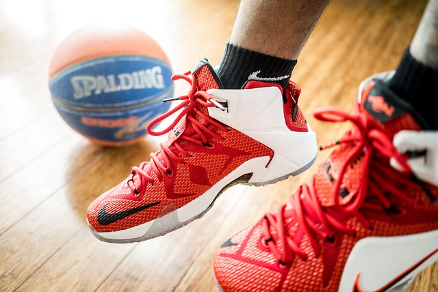 basketball shoes with basketball on wood court