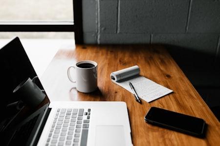 Writing a pharmacy technician resume on a laptop