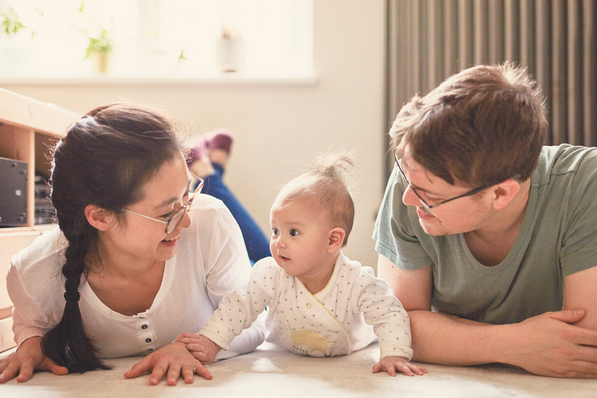 Infant lifting their chest. Poppyseed Play