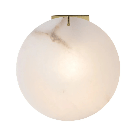 A modern wall sconce with a round alabaster shade and brass mount, featuring a soft, diffused glow for elegant ambient lighting.
