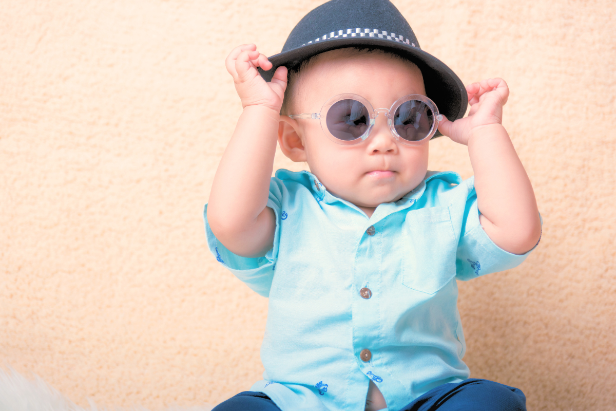 Baby boy wearing hat and sunglasses