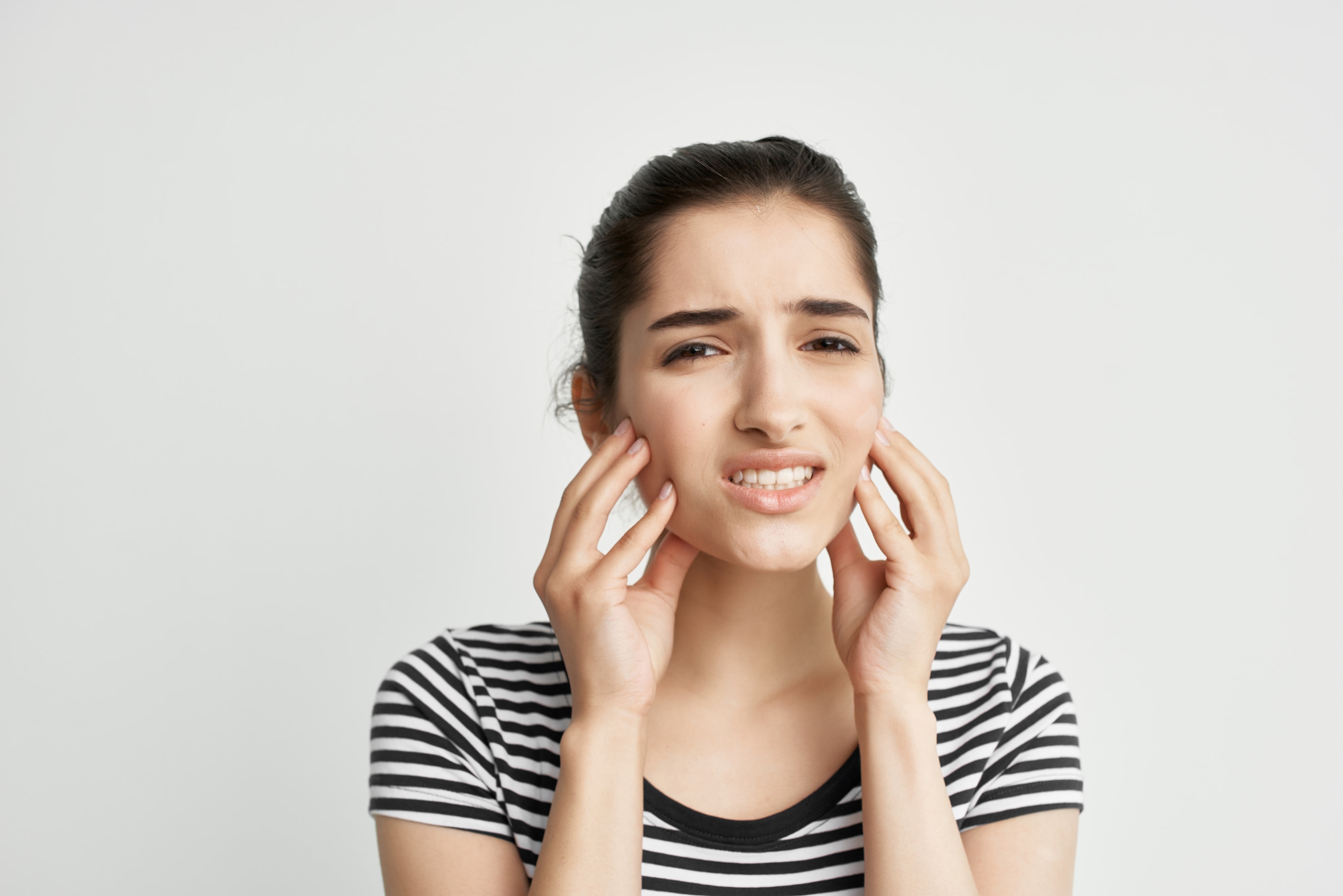 Woman after getting wisdom teeth removed and is impacting her speech