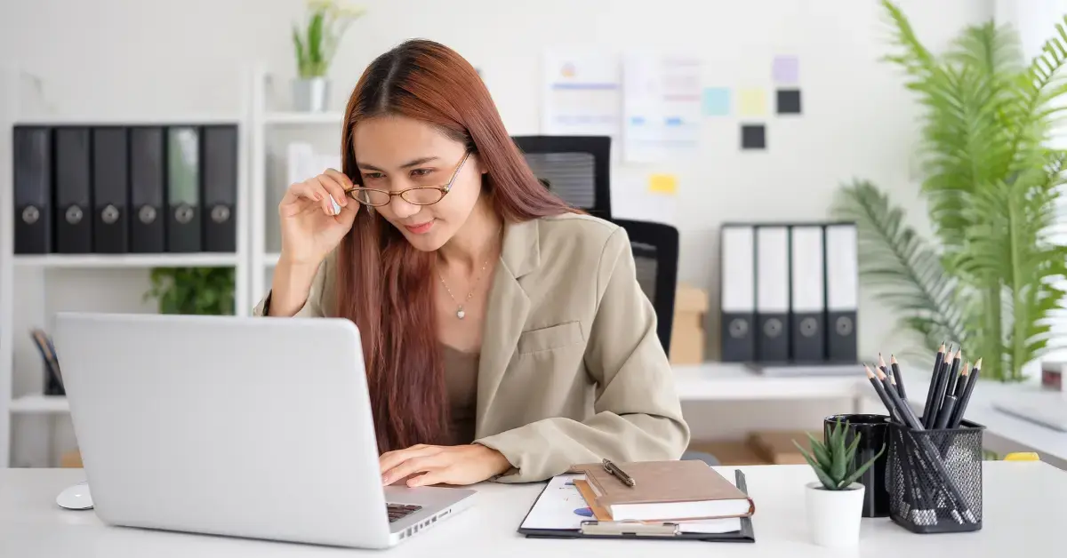 Woman reviewing an independent contractor agreement before hiring support.