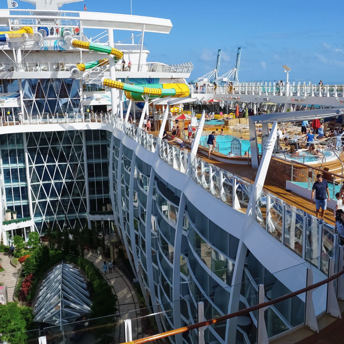 Miami, USA - April 29, 2022: People having fun at pools, bars, entertainment and innovative activities at Symphony of the seas is the biggest cruise ship at Miami, USA on April 29, 2022