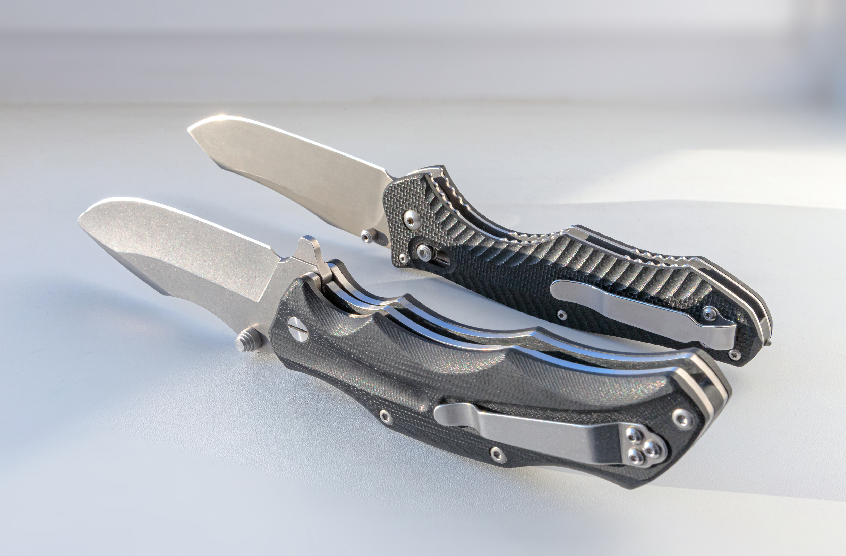 folding knives on a light background close-up