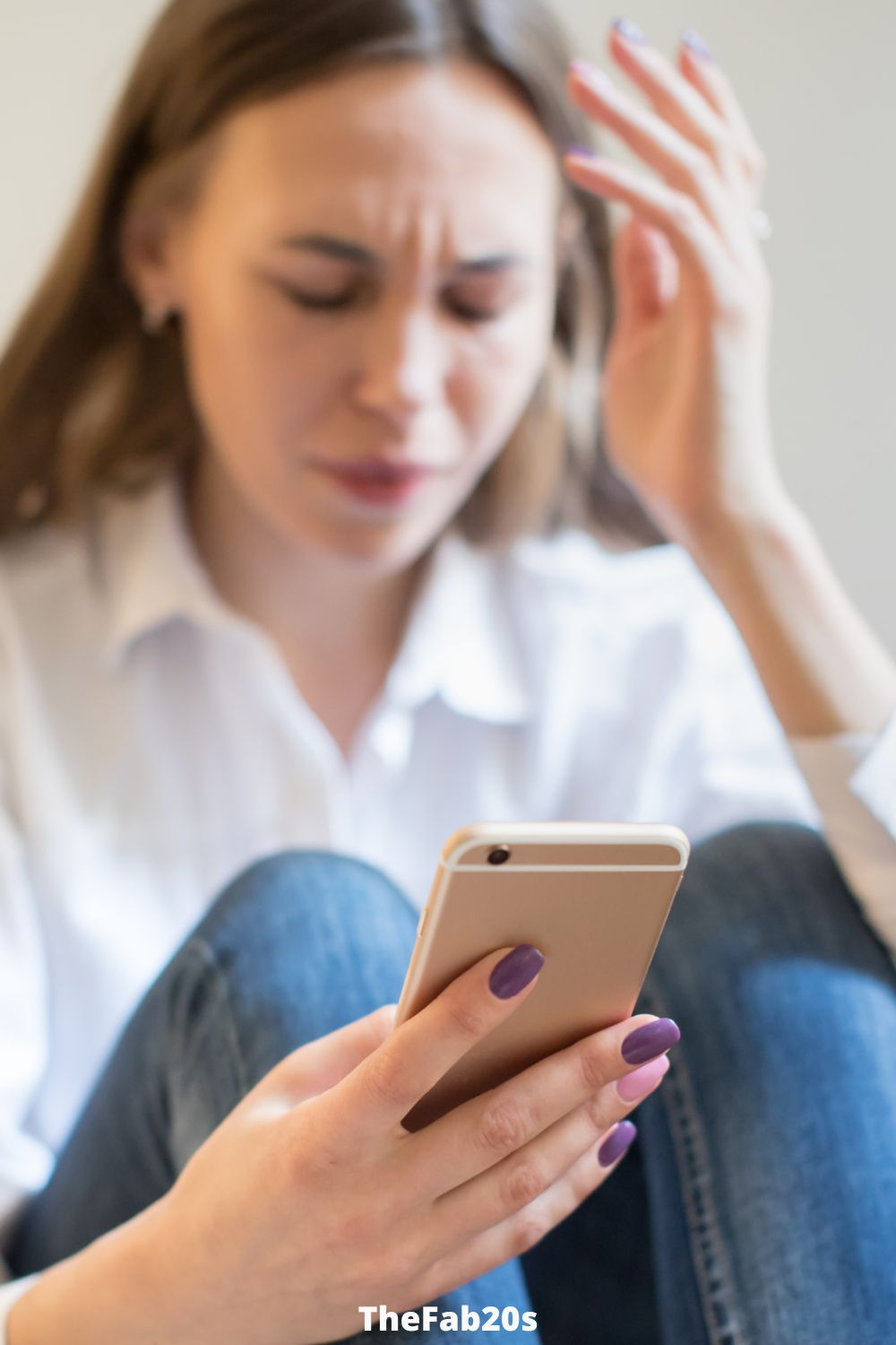 Woman upset, checking phone