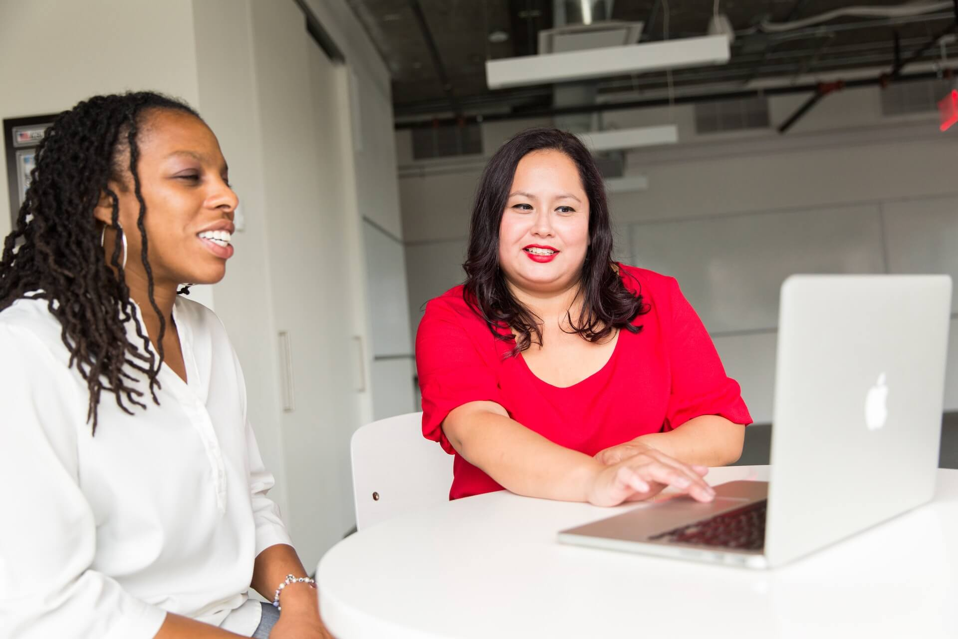 a manager and team member having a goal setting meeting