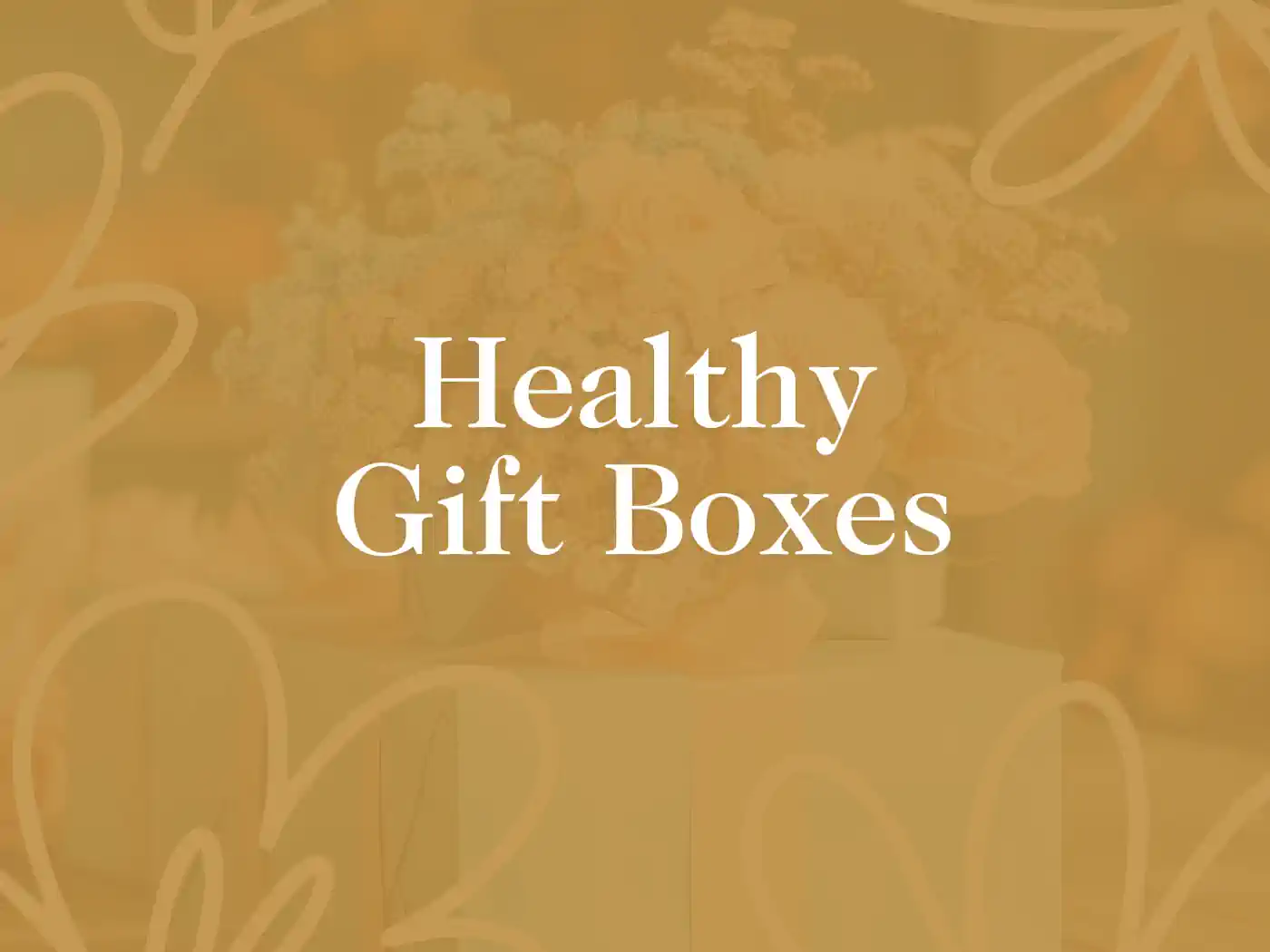 Elegant promotional banner featuring the text 'Healthy Gift Boxes' overlaid on a soft, golden background with a blurred image of a bouquet of flowers, symbolizing wellness and care. Guest House and Hotel Gift Boxes Delivered with Heart. Fabulous Flowers and Gifts.