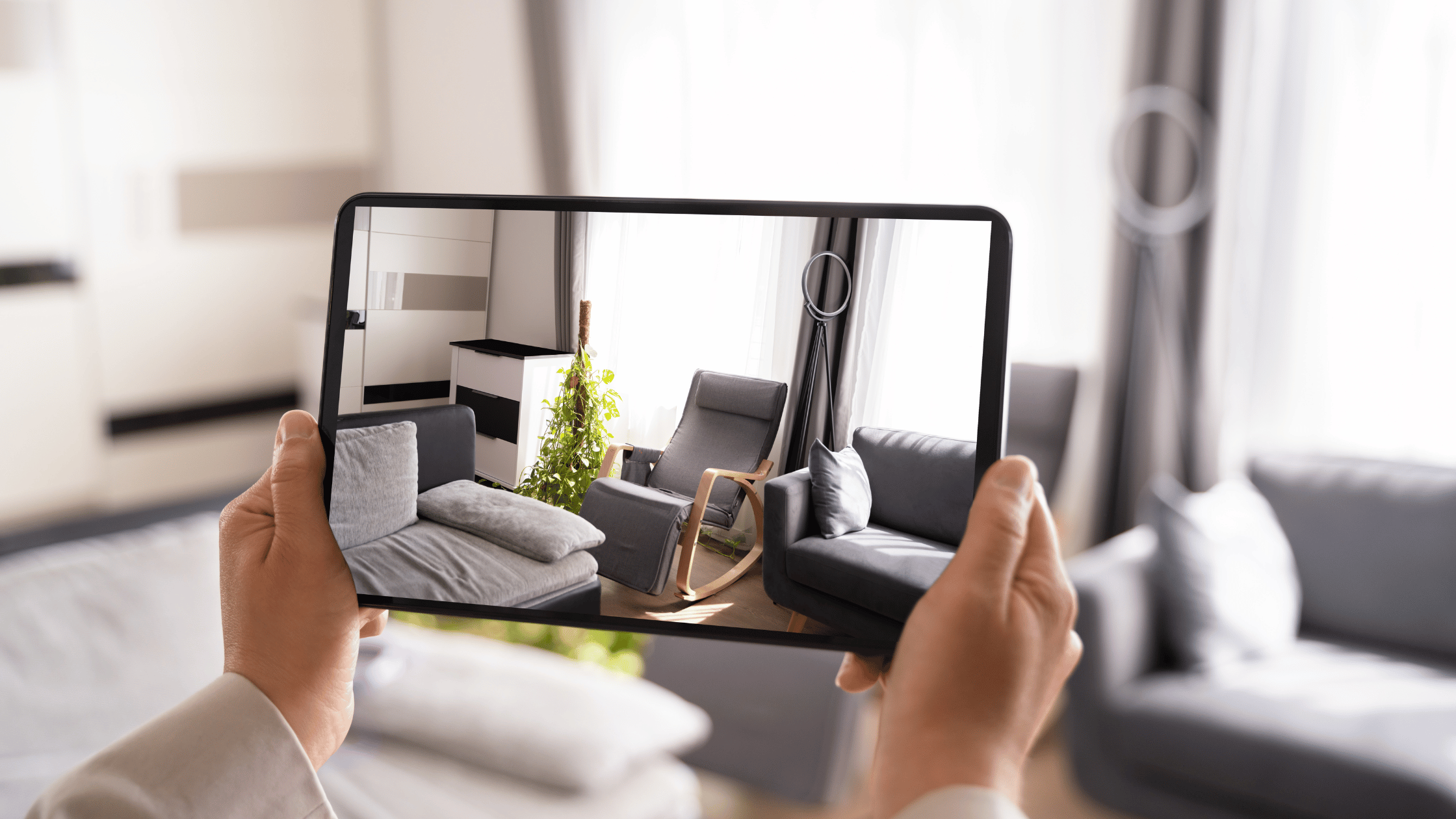 A person holding a smartphone displaying a virtual tour, showcasing how immersive experiences can attract potential clients and help homes sell faster at a higher price.