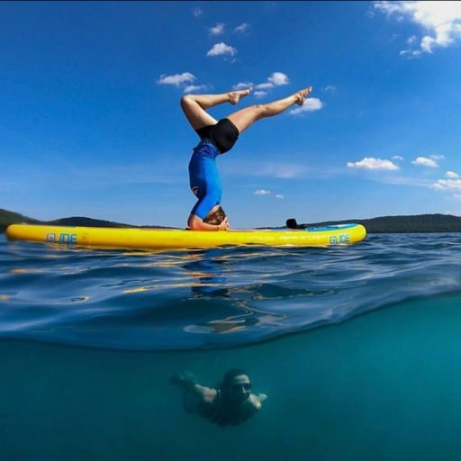 sup yoga on an inflatable paddle board