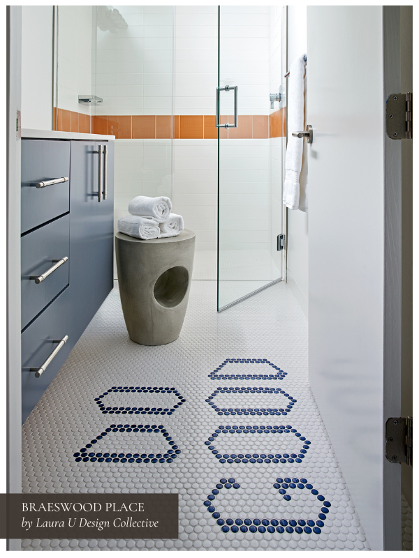 "Do Good" in blue circular tiles on a white tiled floor in a blue, white, and orange bathroom