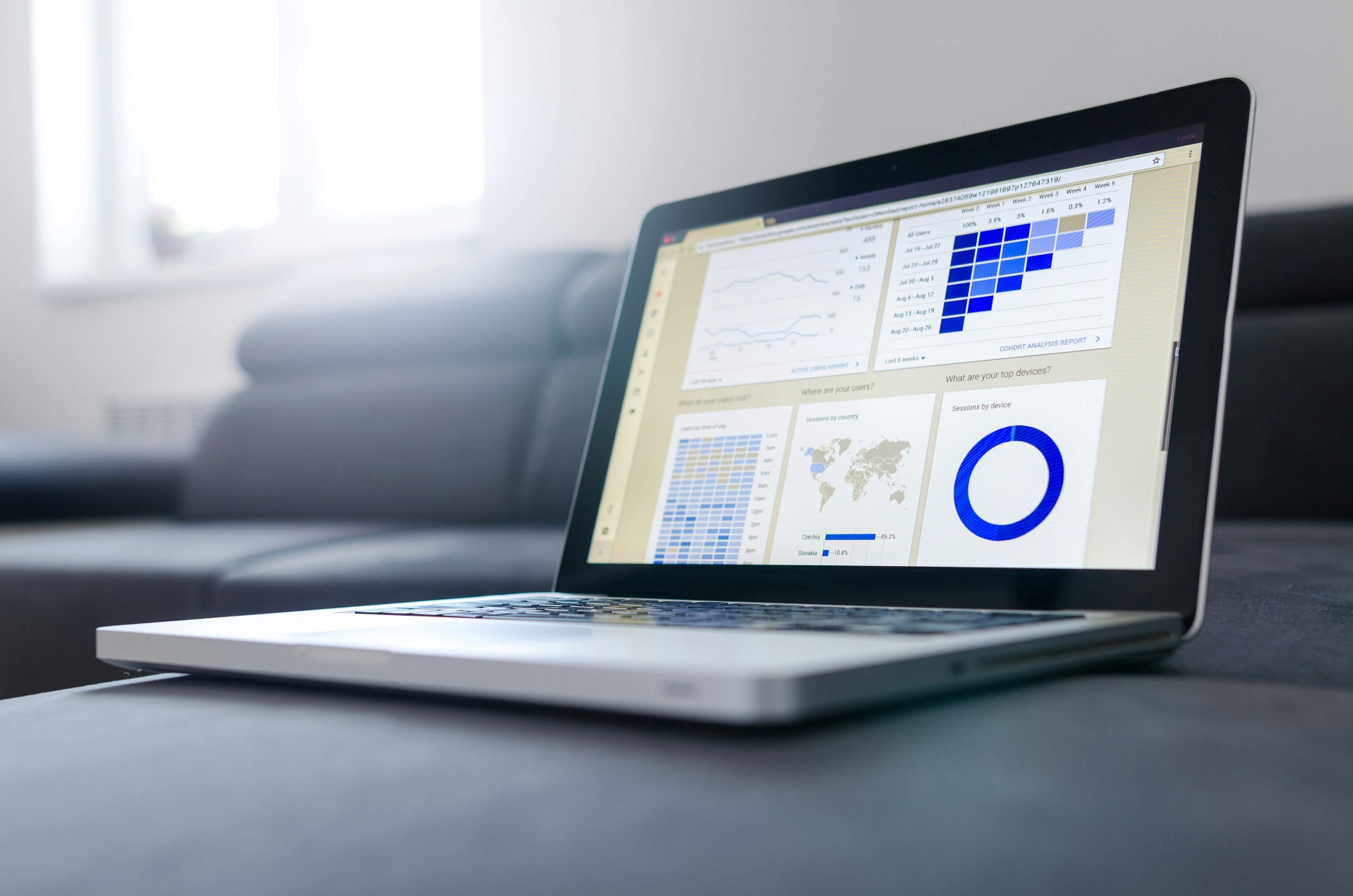 Real estate investor tracks market trends via multiple charts and graphs.