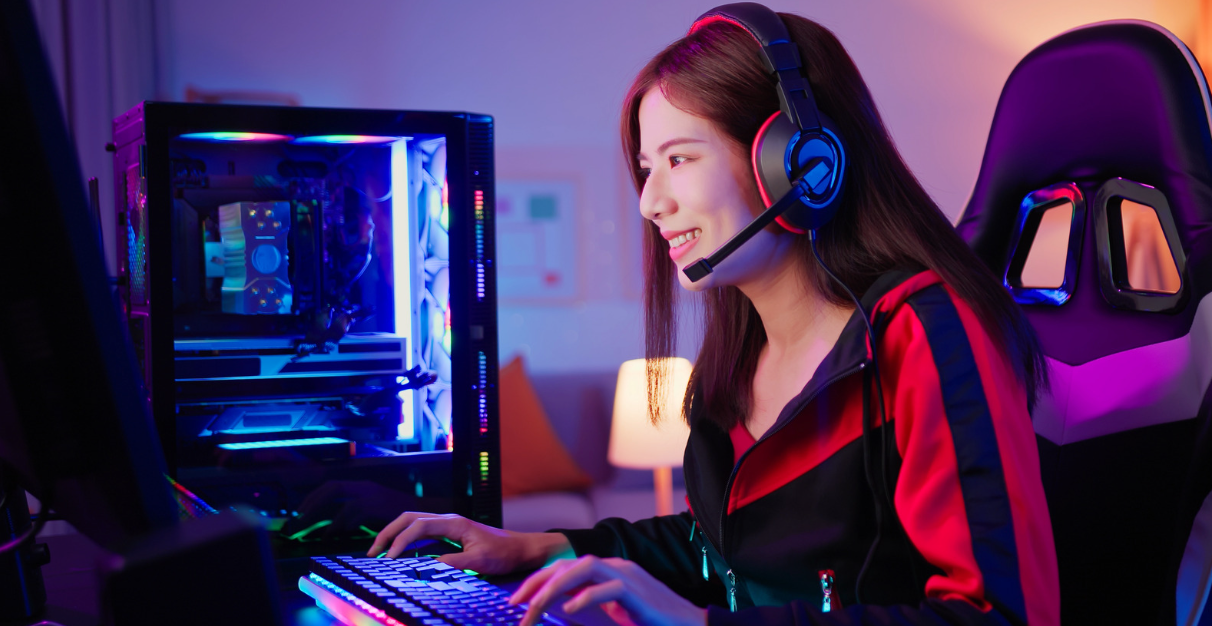 Headset-wearing gamer enjoing PC game