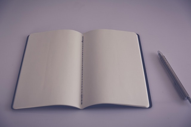 A blank notebook and pen.