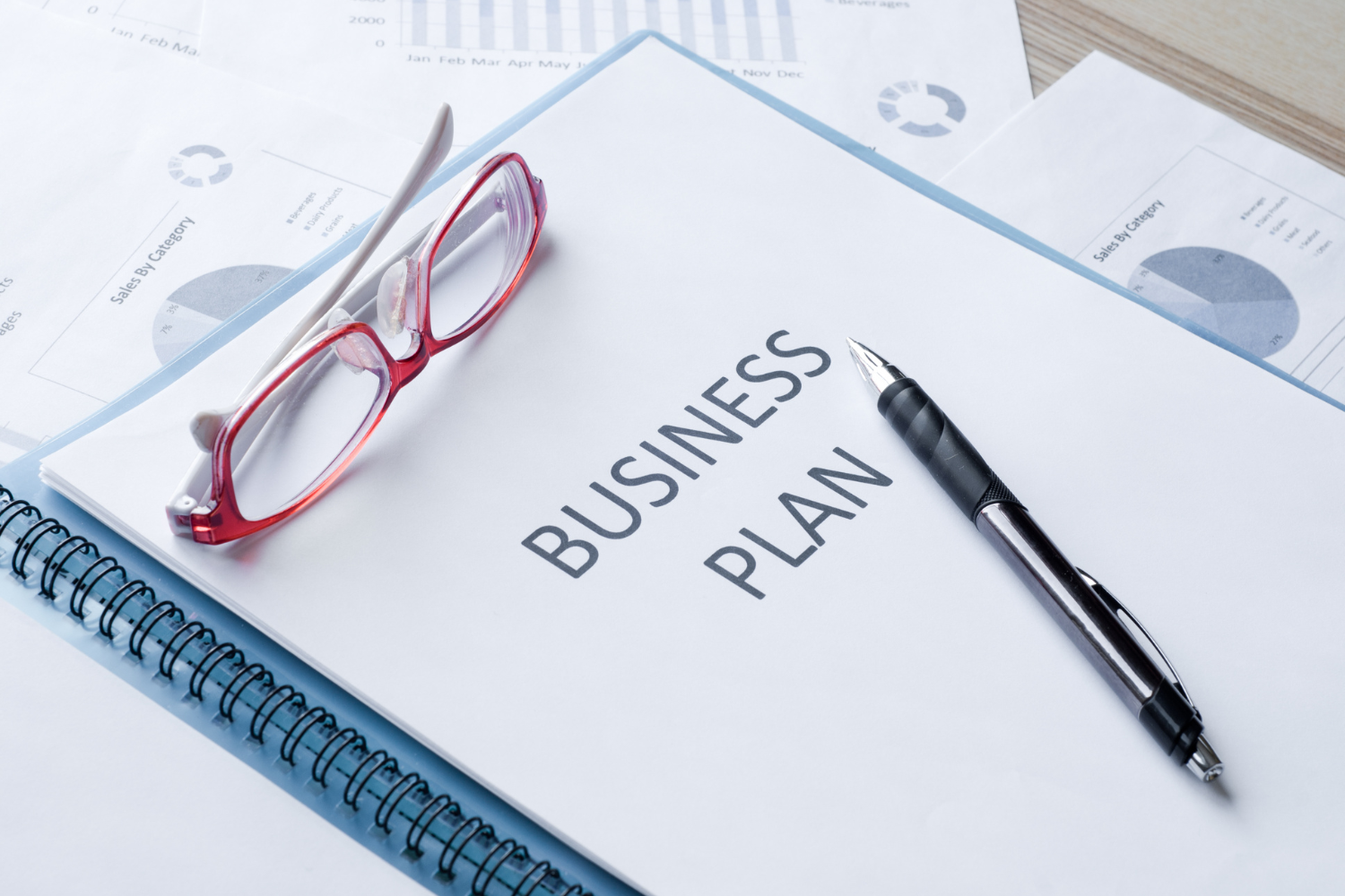 A folder with "Business Plan" labeled at the front.