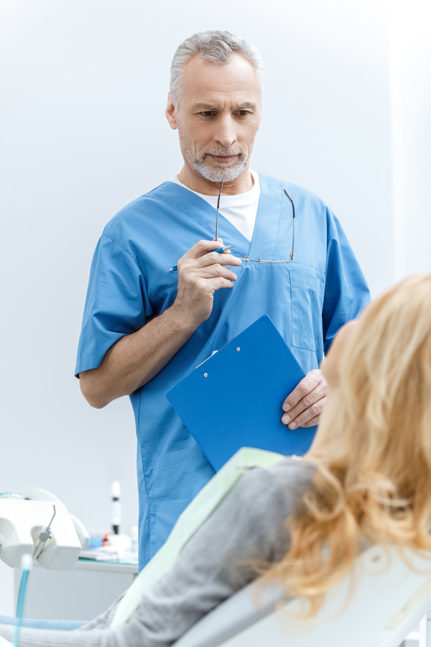 oral surgeon talking to patient