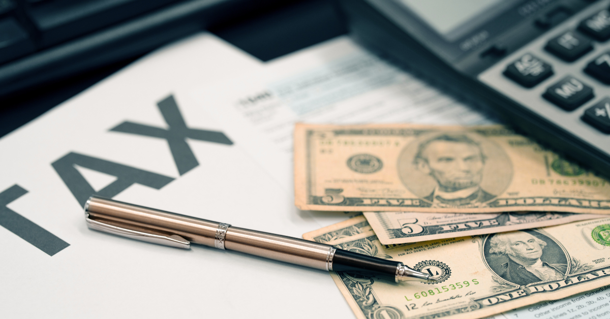 Calculating taxes with a calculator and tax document, exploring if tips are taxable and how to report tip income