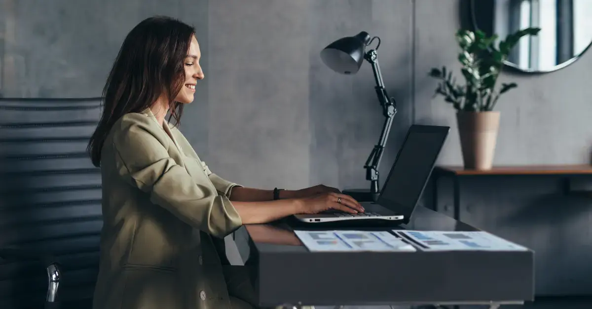 Woman organizing side hustle taxes and online income records at home.