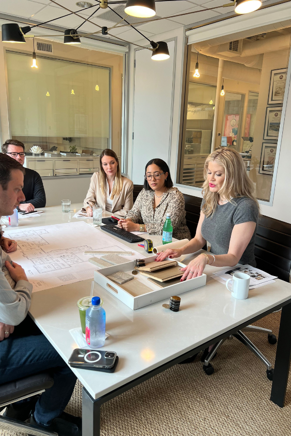 the LUDC team in the studio giving a client presentation