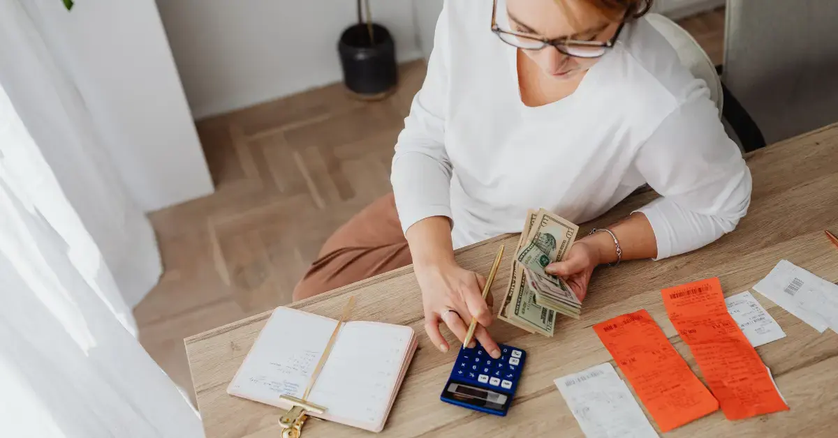 Woman planning her finances and tax savings based on the 2026 Social Security tax limit.