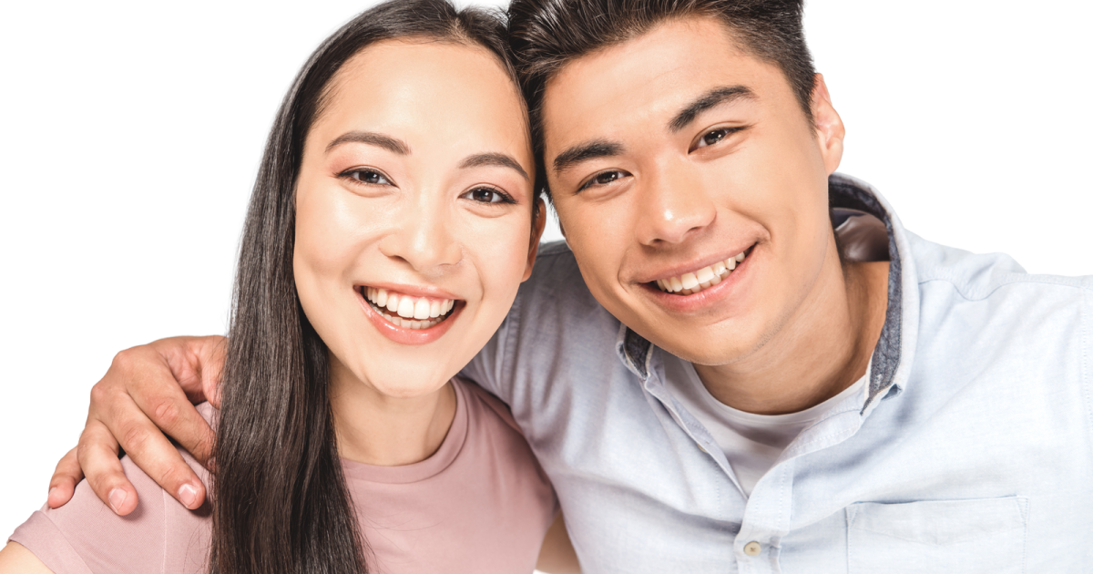 Happy couple smiling together after successful marriage counseling at Loving at Your Best, having healed from emotional and sexual infidelity.