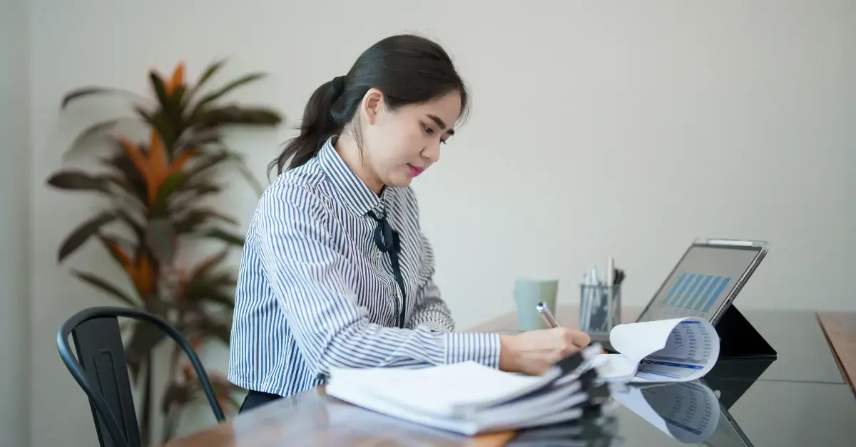 Woman reviewing an IRS notice and Form 9423 for the collection appeals program.