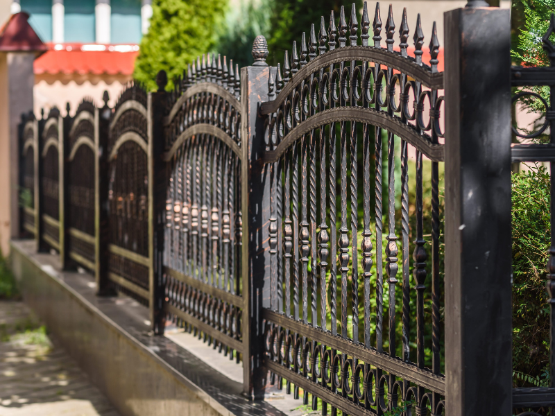An image showing elegant wrought iron fence for home security.