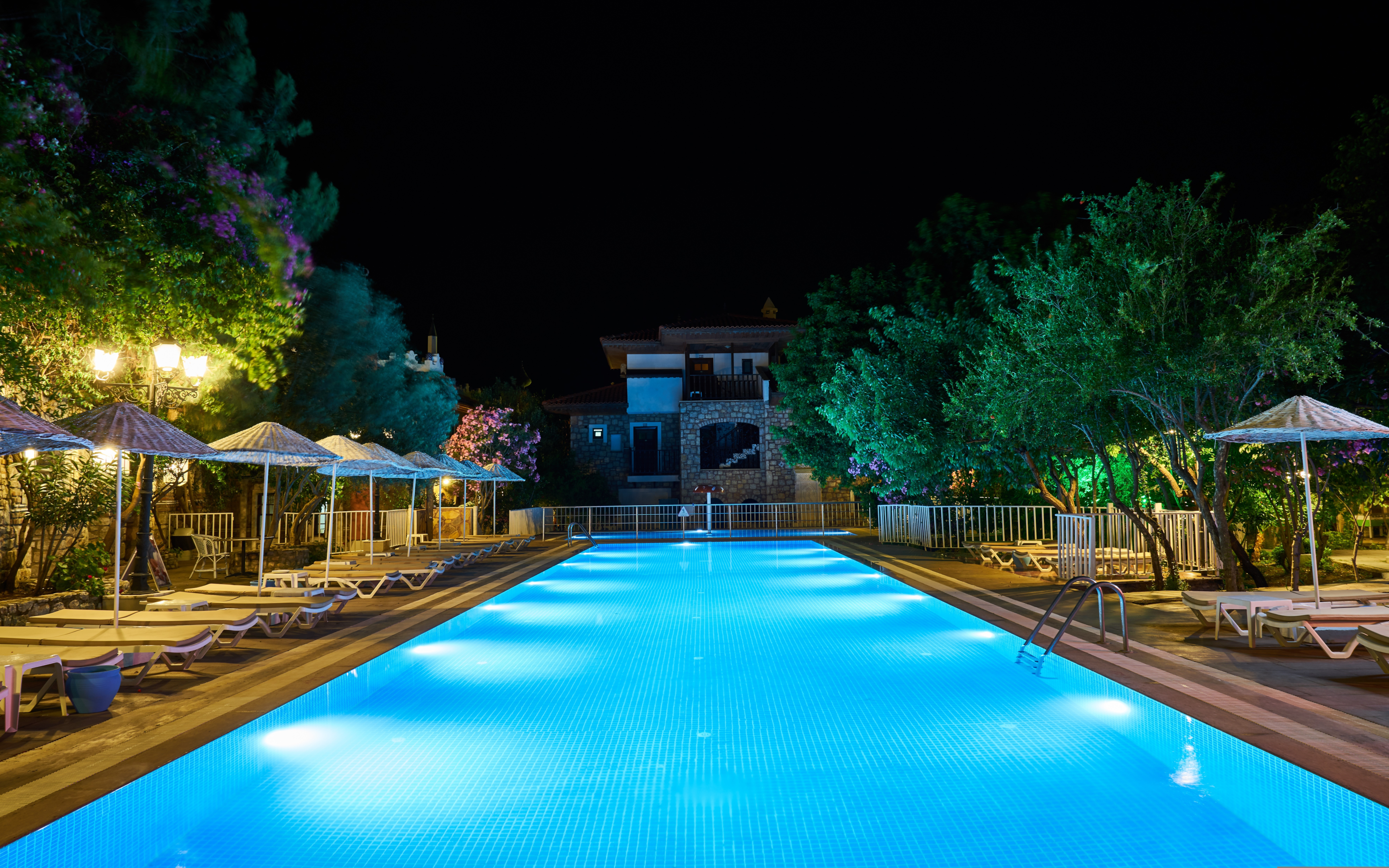 Outdoor Pool Area with Submerged Fountain Lights