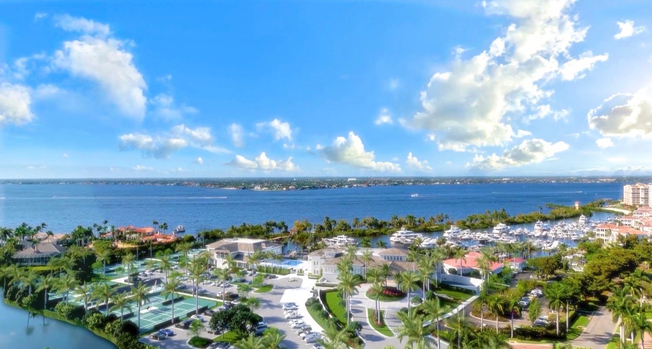 An aerial view of Gulf Harbour Yacht & Country Club showcases the expansive marina, championship golf course, and luxury homes nestled along the scenic Caloosahatchee River, highlighting the vibrant community and world-class amenities available in this premier destination in Fort Myers, Florida. The lush landscapes and stunning views offer a glimpse into the exceptional lifestyle that Gulf Harbour has to offer.