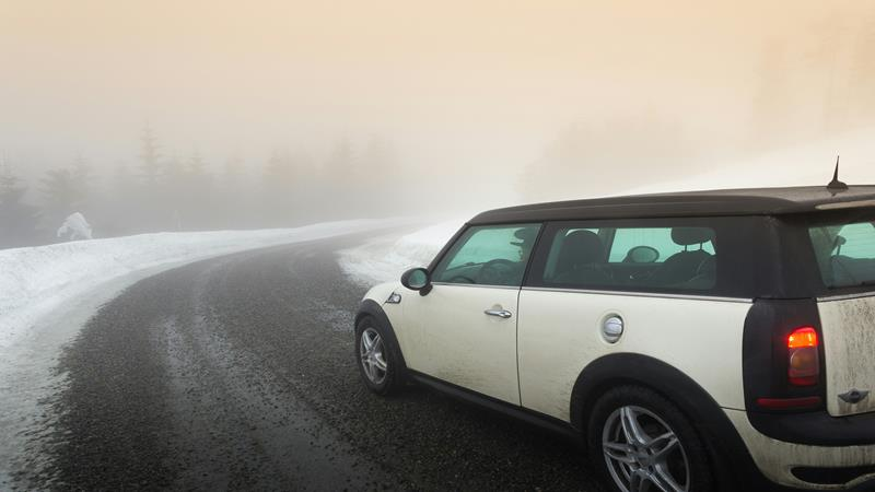 Car driving through foggy conditions