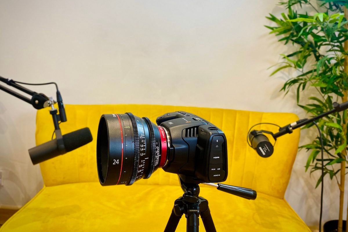 Yellow sofa with microphones and camera