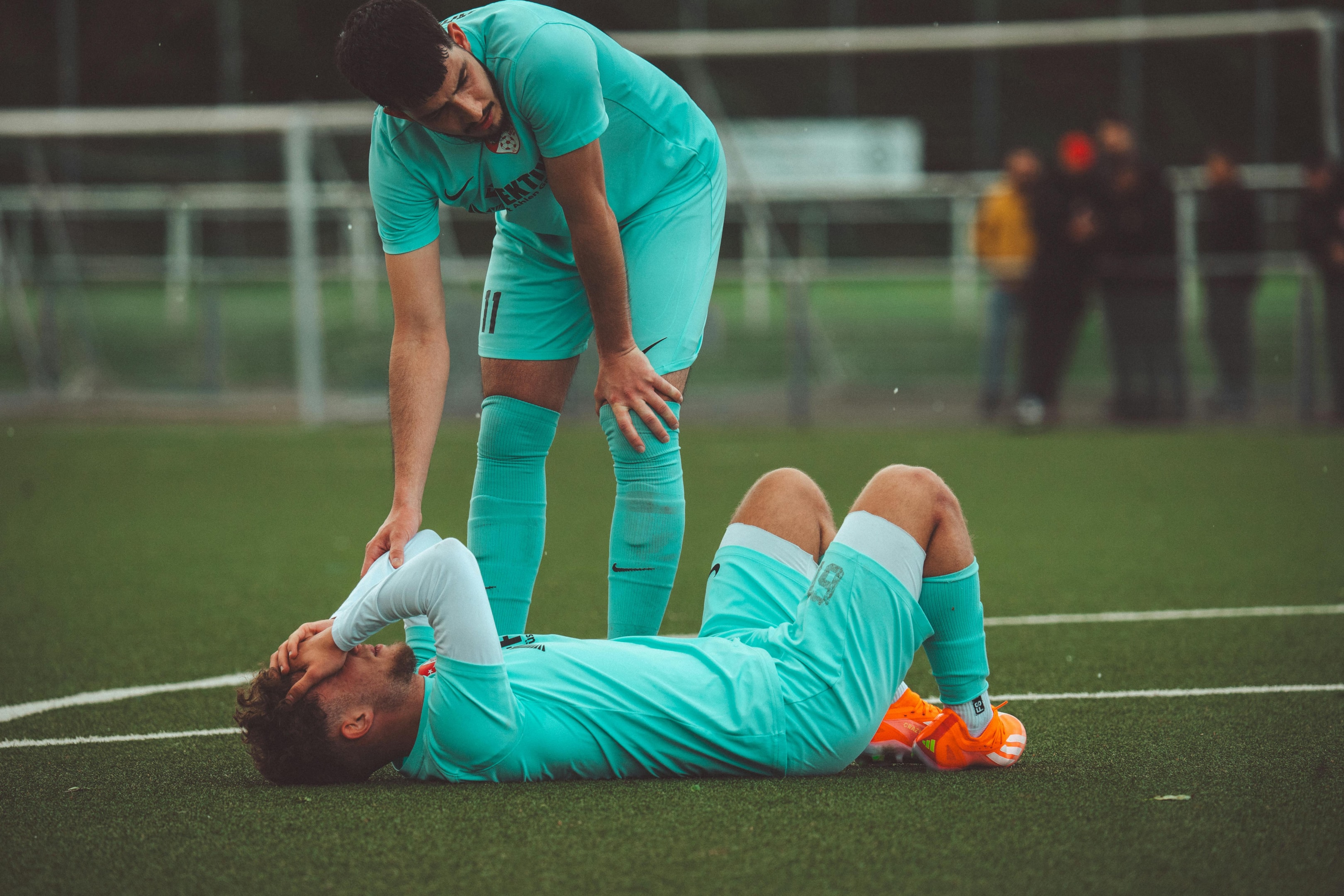 Photo by Omar Ramadan: https://www.pexels.com/photo/soccer-player-lying-on-grass-22028303/