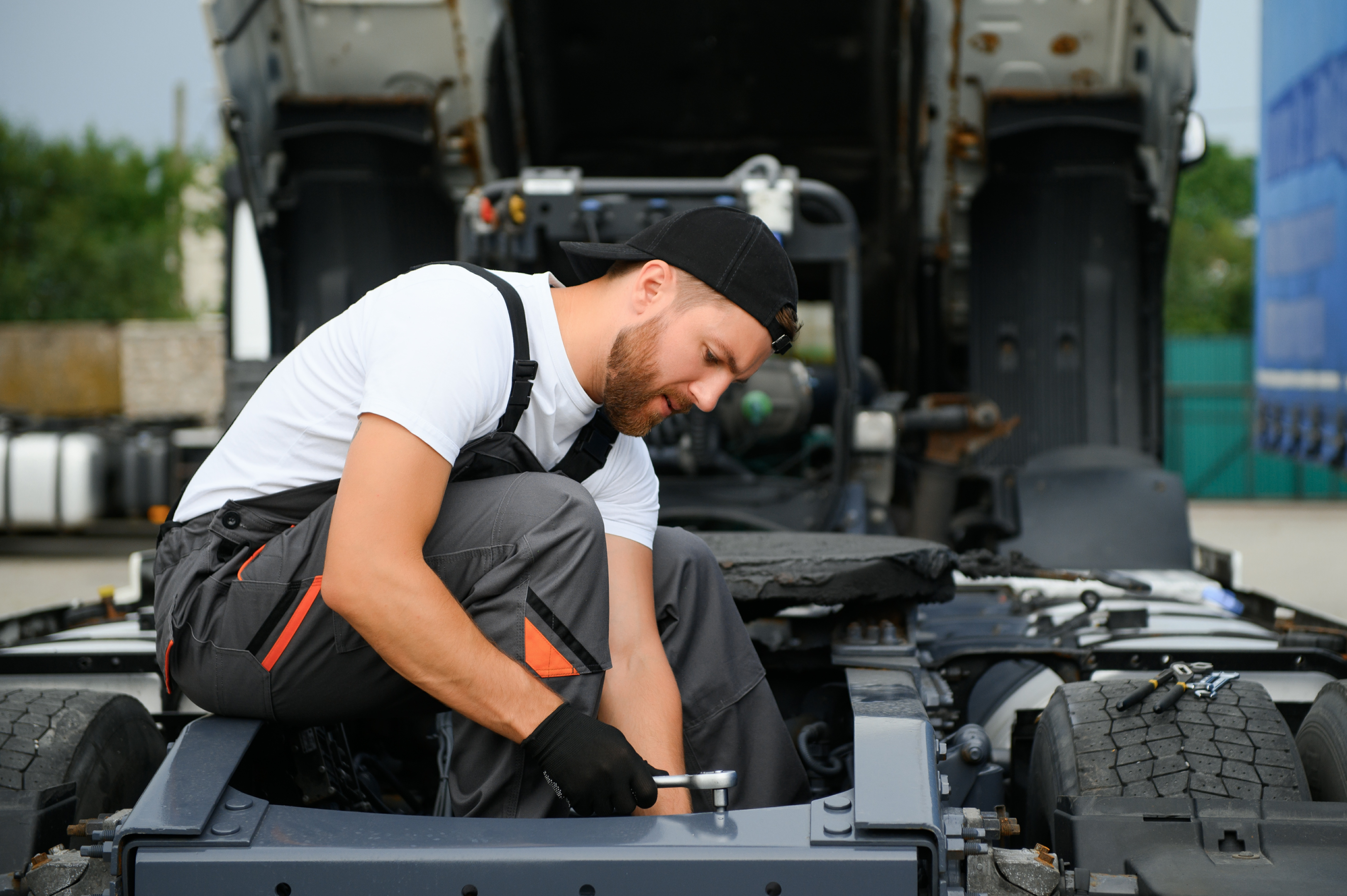 Fleet vehicles being maintained in a workshop; future vehicle acquisition can benefit with an already setup preventive maintenance from a fleet management software.