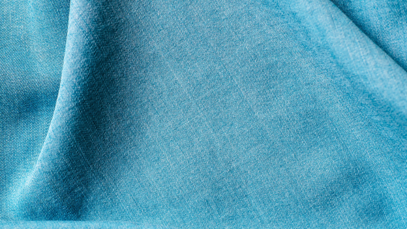 A close up shot of a blue lyocell fabric