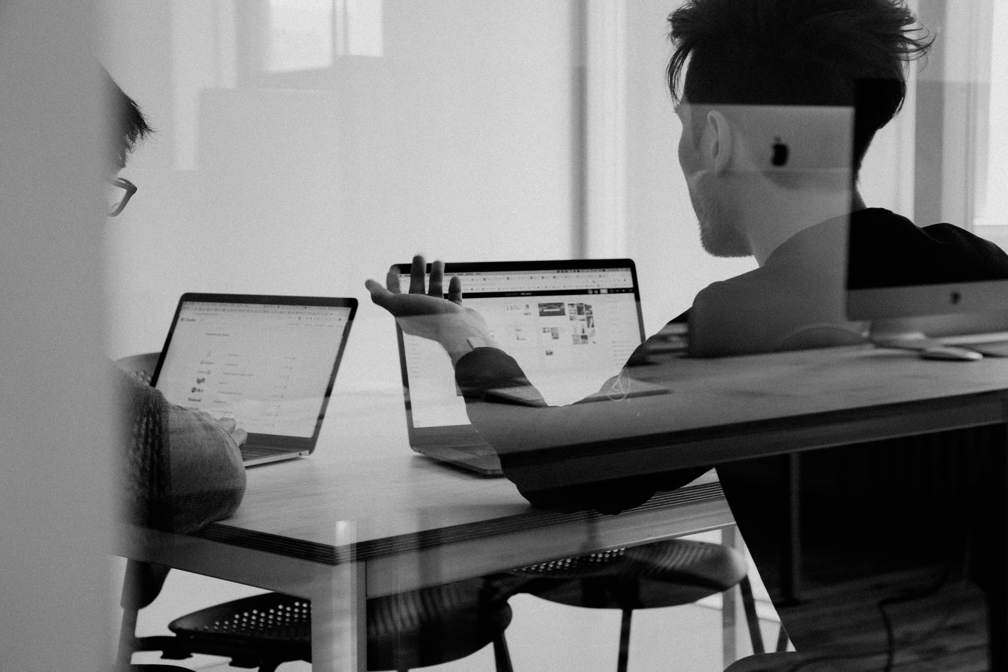 Real estate investment team reviews portfolio management software.