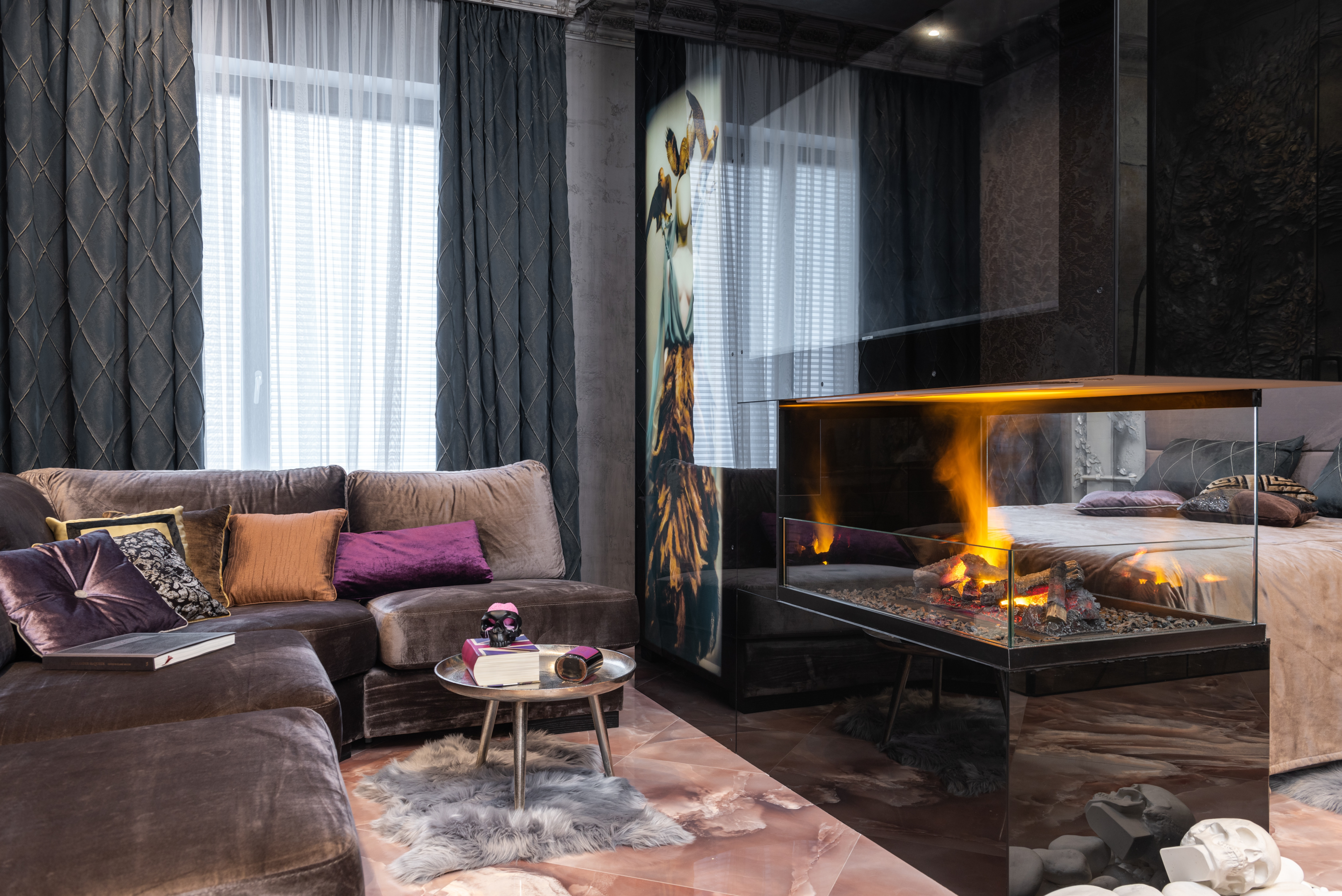 modern fireplace with faux fur rug and couch