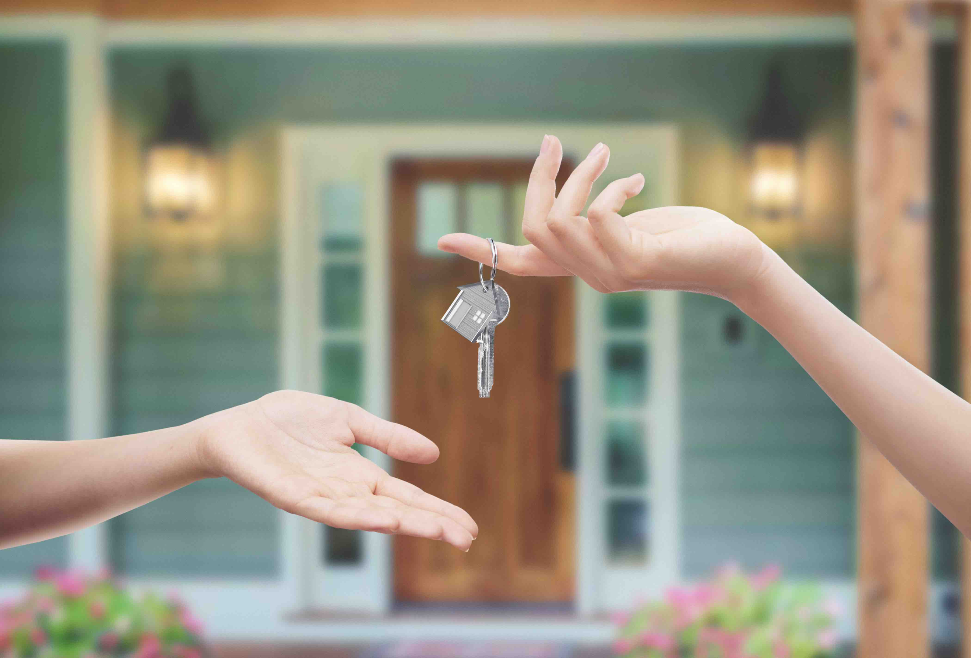 A rental property with a "For Rent" sign in front of it