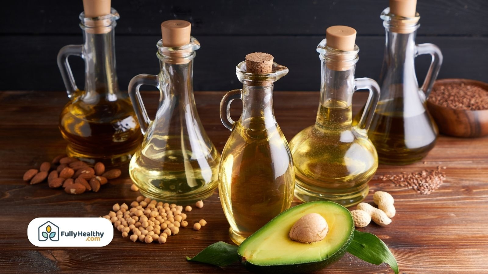 Assorted oils with avocado, nuts, and healthy seeds