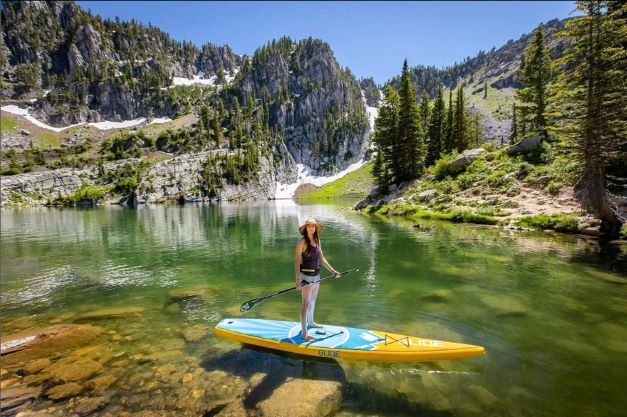 inflatable paddle board on a mountain lake