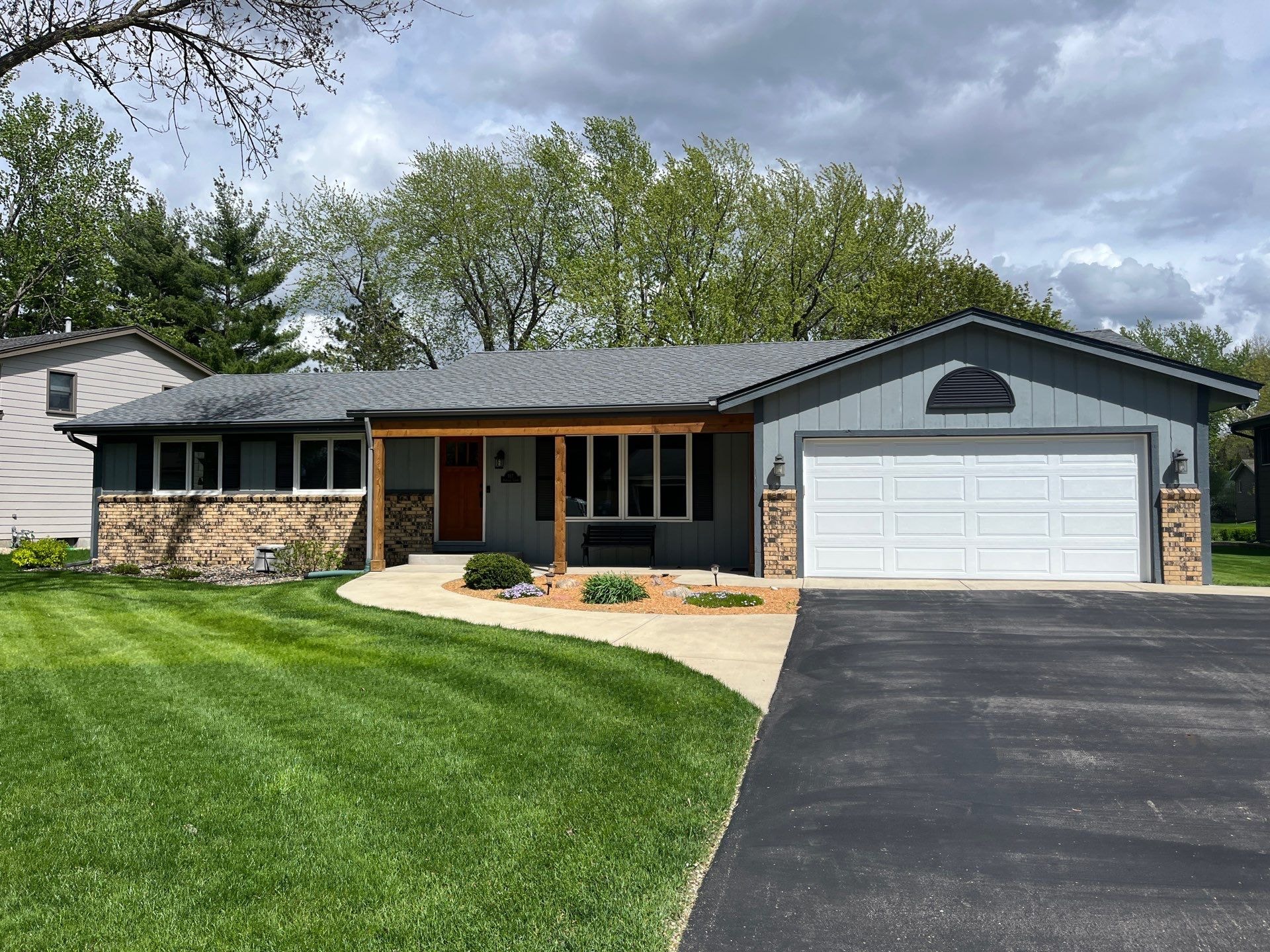 Gray and white painted exterior of a single-story home