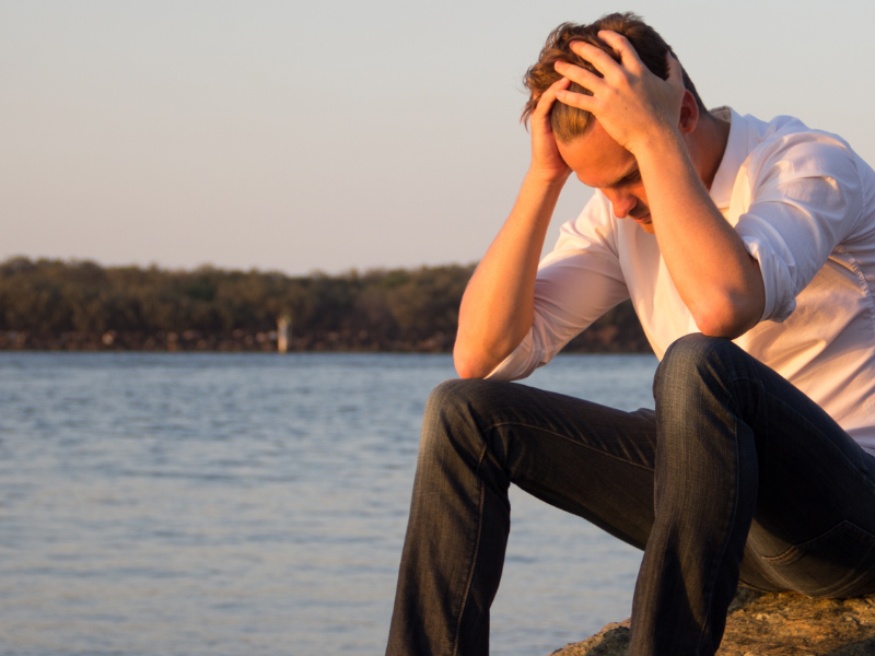 Image showing a person distressed after a car accident.
