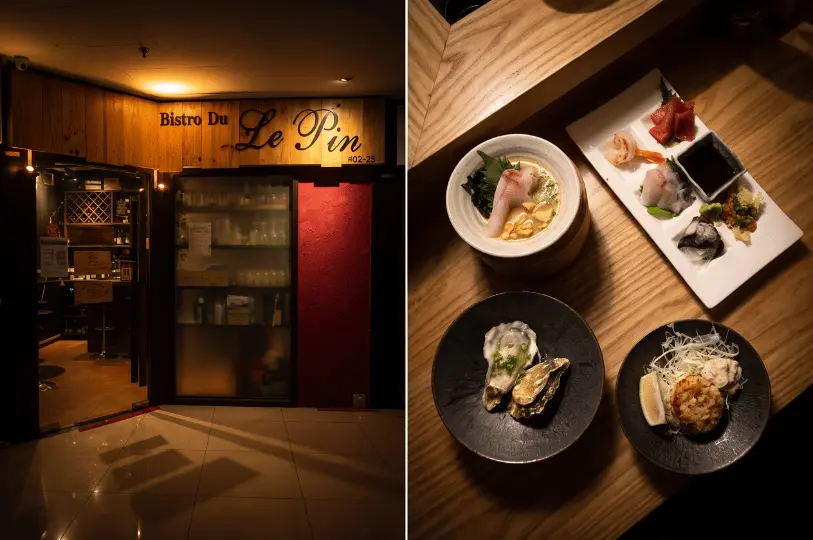A split image showing the dimly lit, wood-paneled storefront of Bistro Du Le Pin at unit #02-25 on the left, and an overhead view of a wooden table featuring assorted Japanese dishes—including a sashimi platter, raw oysters on the half shell, a bowl of seafood broth, and a fried patty with shredded cabbage—on the right.