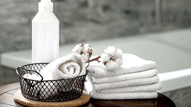 Stack of white microfiber towels at a spa