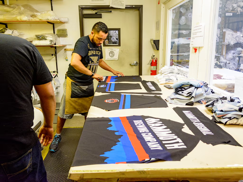 Image of Canari team members creating a custom cycling jersey.